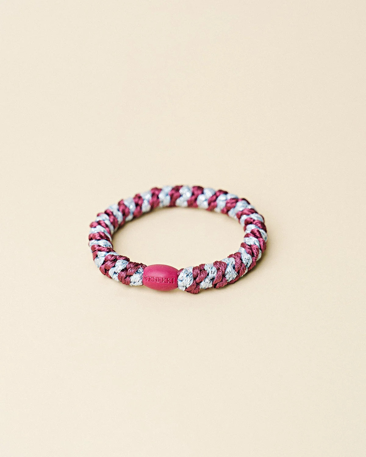 Gros plan sur l'élastique Kknekki Rosewood Seablue Glitter Stripe tressé